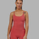 Woman wearing Helix Active Bodysuit - Mineral Red