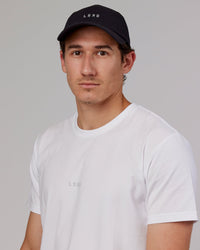 Man wearing Hybrid Performance Cap - Black