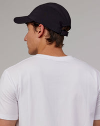 Man wearing Hybrid Performance Cap - Black