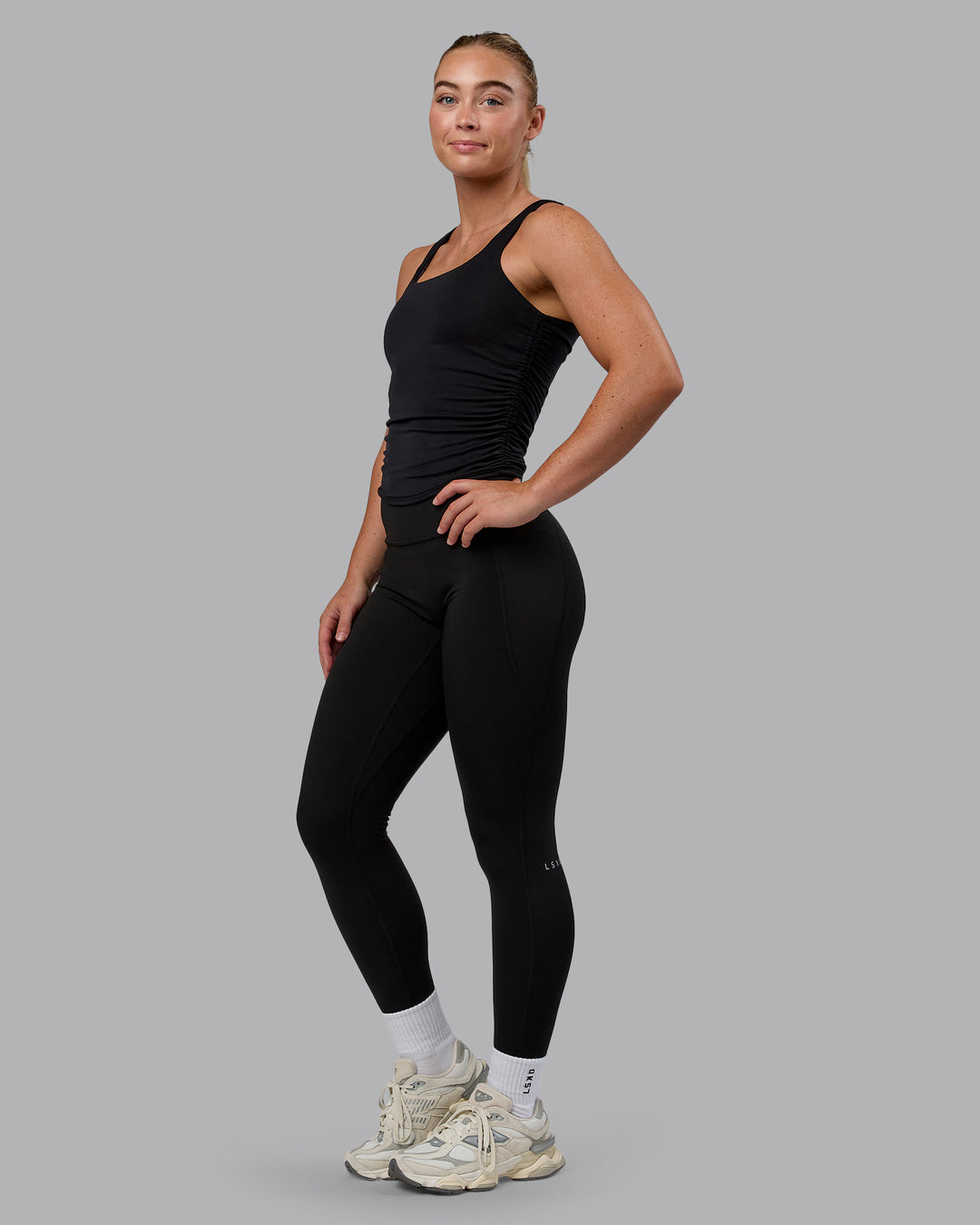 Woman wearing Ignite Scrunch Side Tank - Black