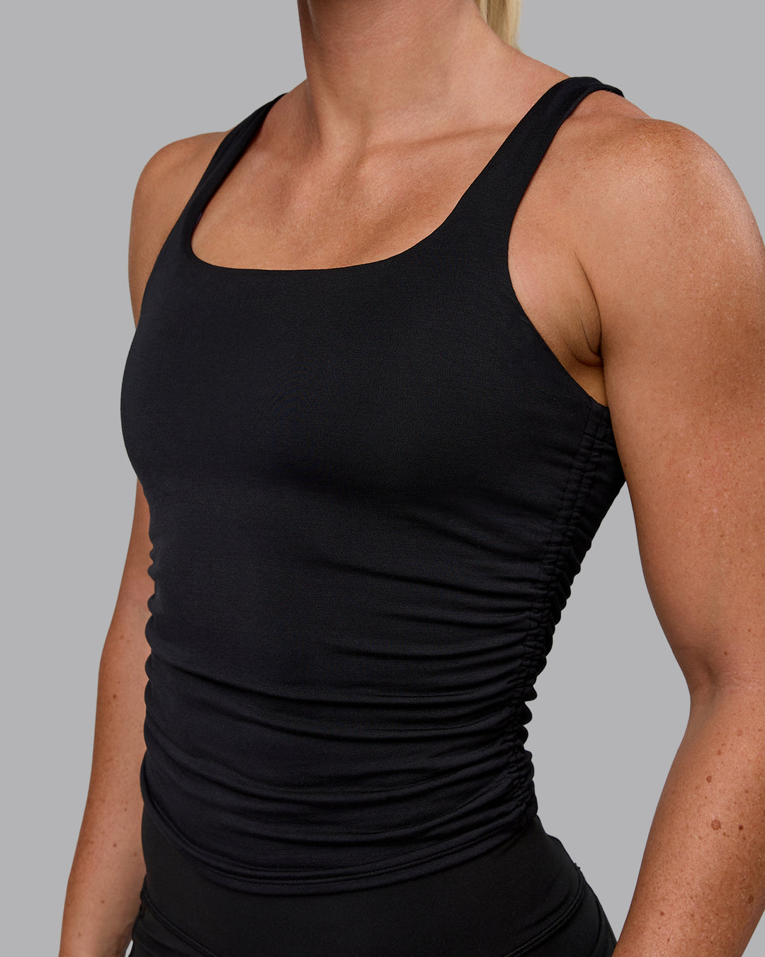 Woman wearing Ignite Scrunch Side Tank - Black