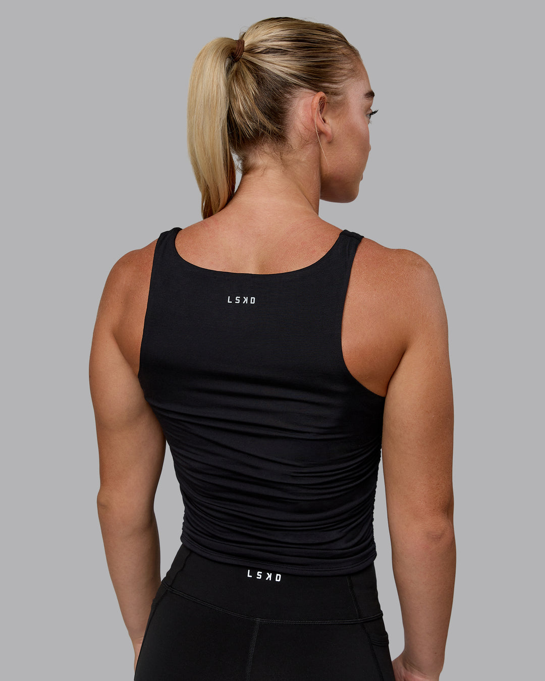 Woman wearing Ignite Scrunch Side Tank - Black