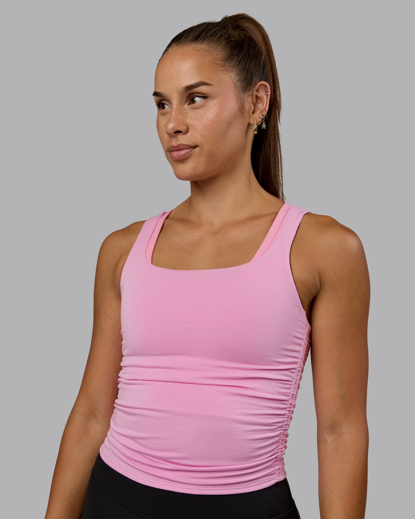 Woman wearing Ignite Scrunch Side Tank - Bubblegum