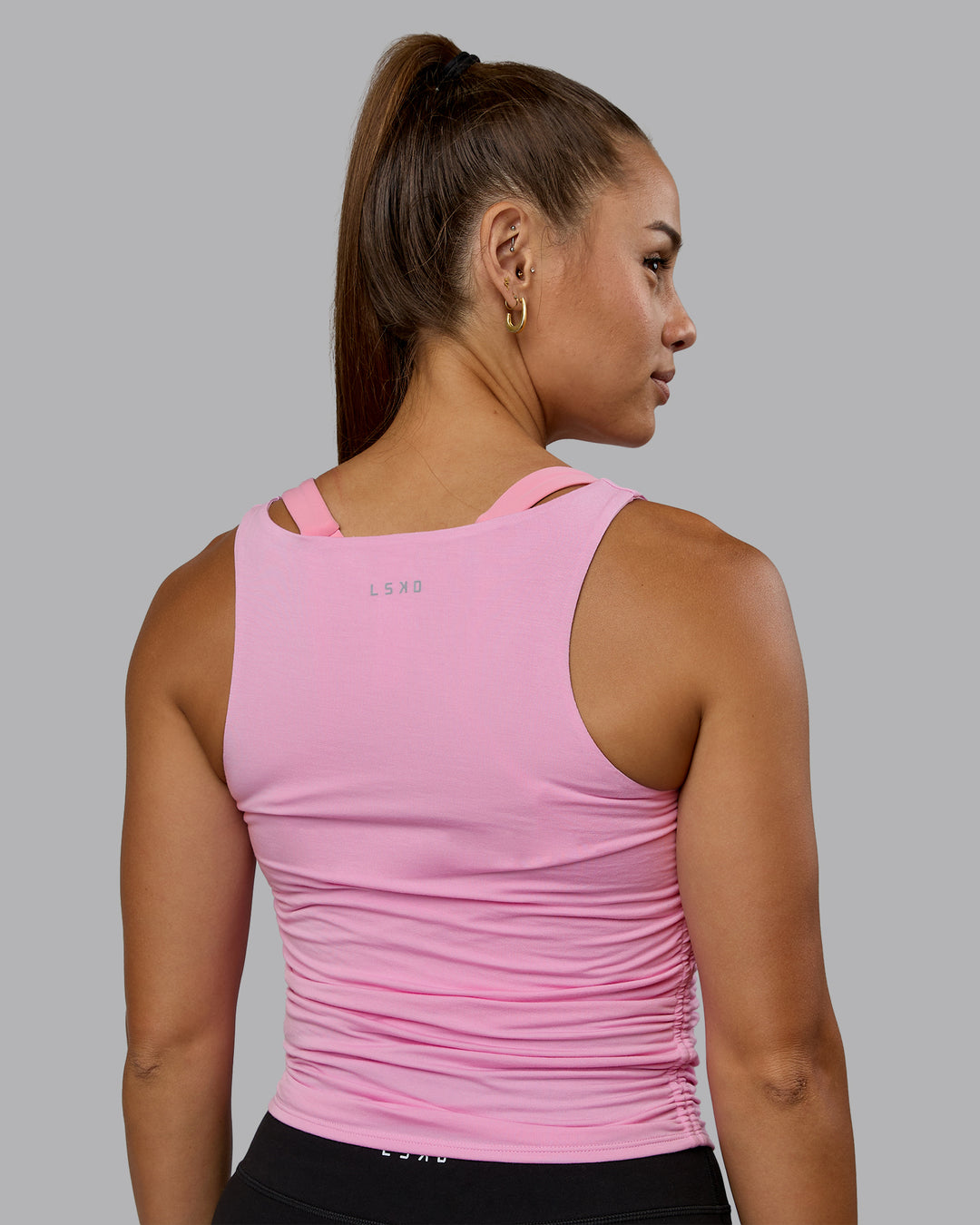 Woman wearing Ignite Scrunch Side Tank - Bubblegum