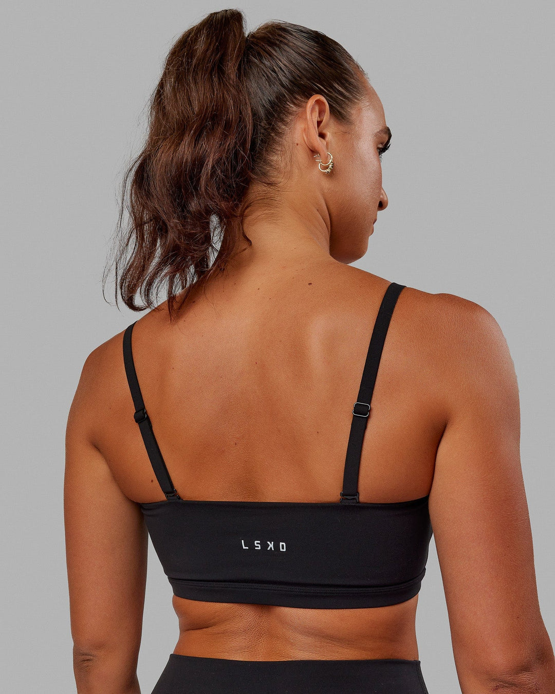 Woman wearing Inspire Sports Bra - Black