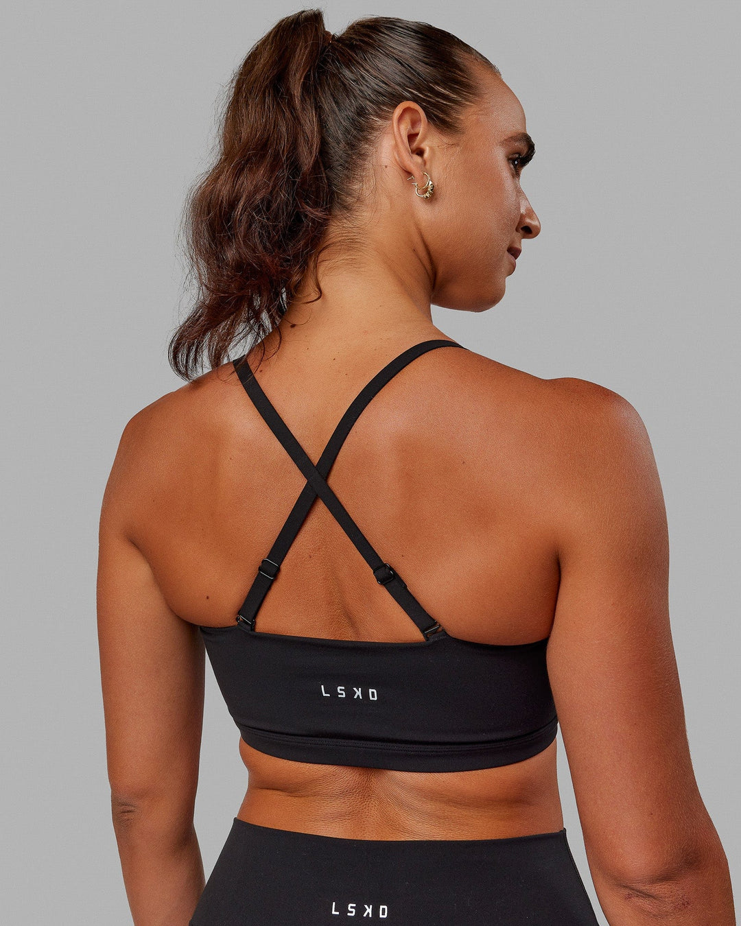 Woman wearing Inspire Sports Bra - Black