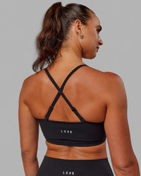 Woman wearing Inspire Sports Bra - Black