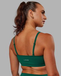 Woman wearing Inspire Sports Bra - Malachite