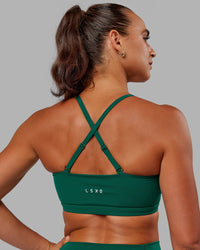 Woman wearing Inspire Sports Bra - Malachite
