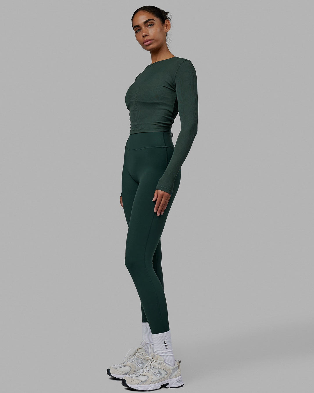Woman wearing Kick On LS Tee - Vital Green