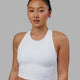Woman wearing LHFM Tank - White