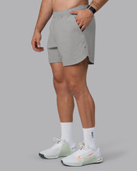 Man wearing Lift 6" Lined Performance Shorts - Circular Grey