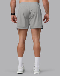 Man wearing Lift 6" Lined Performance Shorts - Circular Grey