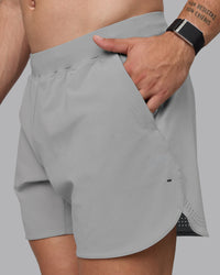 Man wearing Lift 6" Lined Performance Shorts - Circular Grey