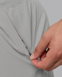 Man wearing Lift 6" Lined Performance Shorts - Circular Grey