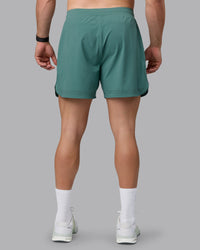 Man wearing Lift 6" Lined Performance Shorts - Sagebrush