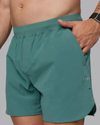 Man wearing Lift 6" Lined Performance Shorts - Sagebrush