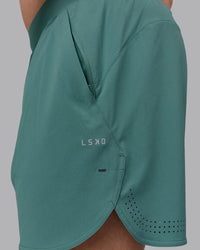 Man wearing Lift 6" Lined Performance Shorts - Sagebrush