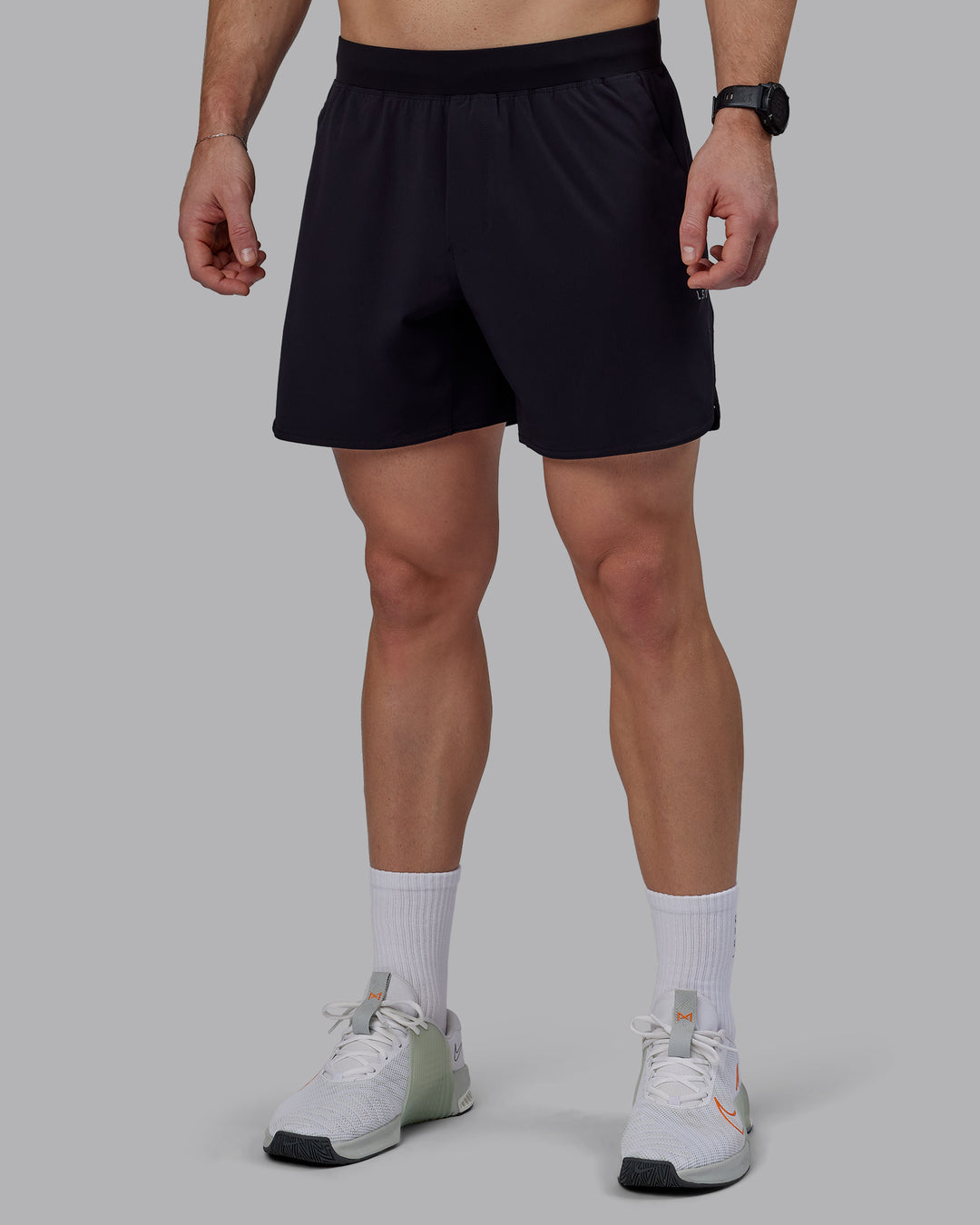 Man wearing Lift 6&quot; Performance Shorts - Black-Reflective