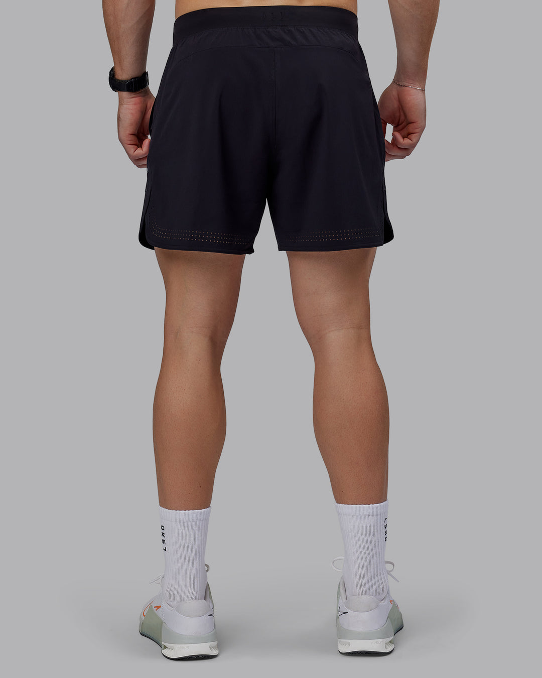 Man wearing Lift 6&quot; Performance Shorts - Black-Reflective