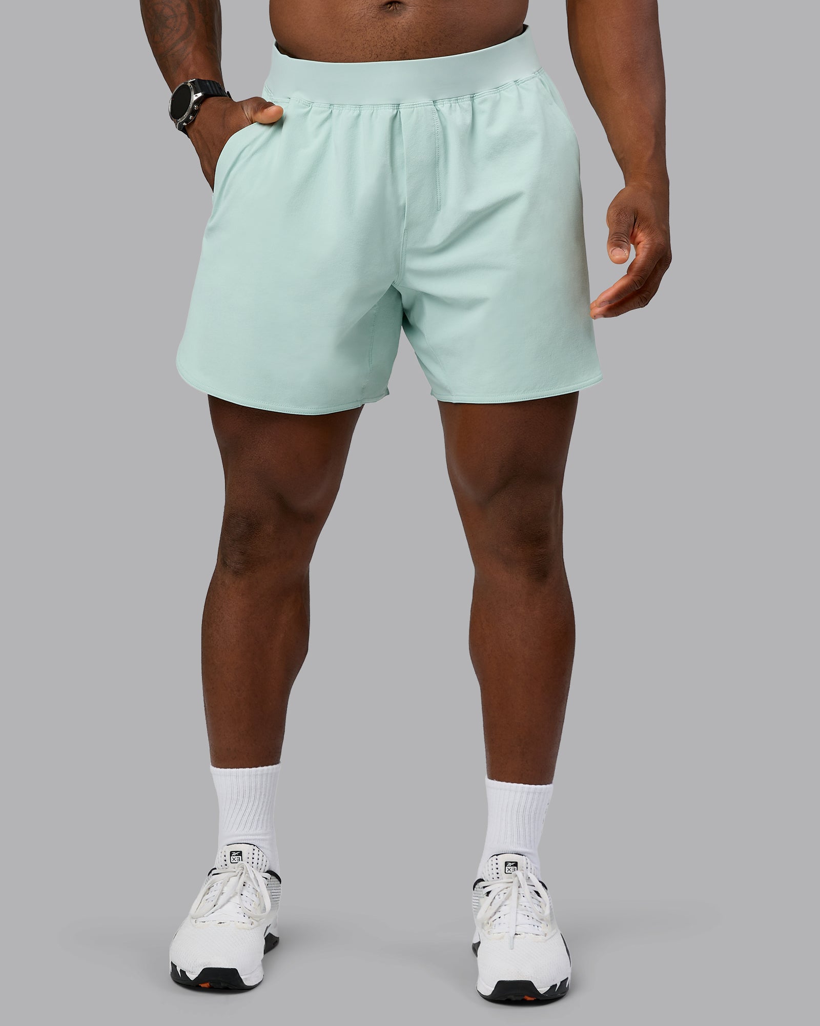 Man wearing Lift 6" Performance Short - Blue Haze | Model:Sam | Size:L