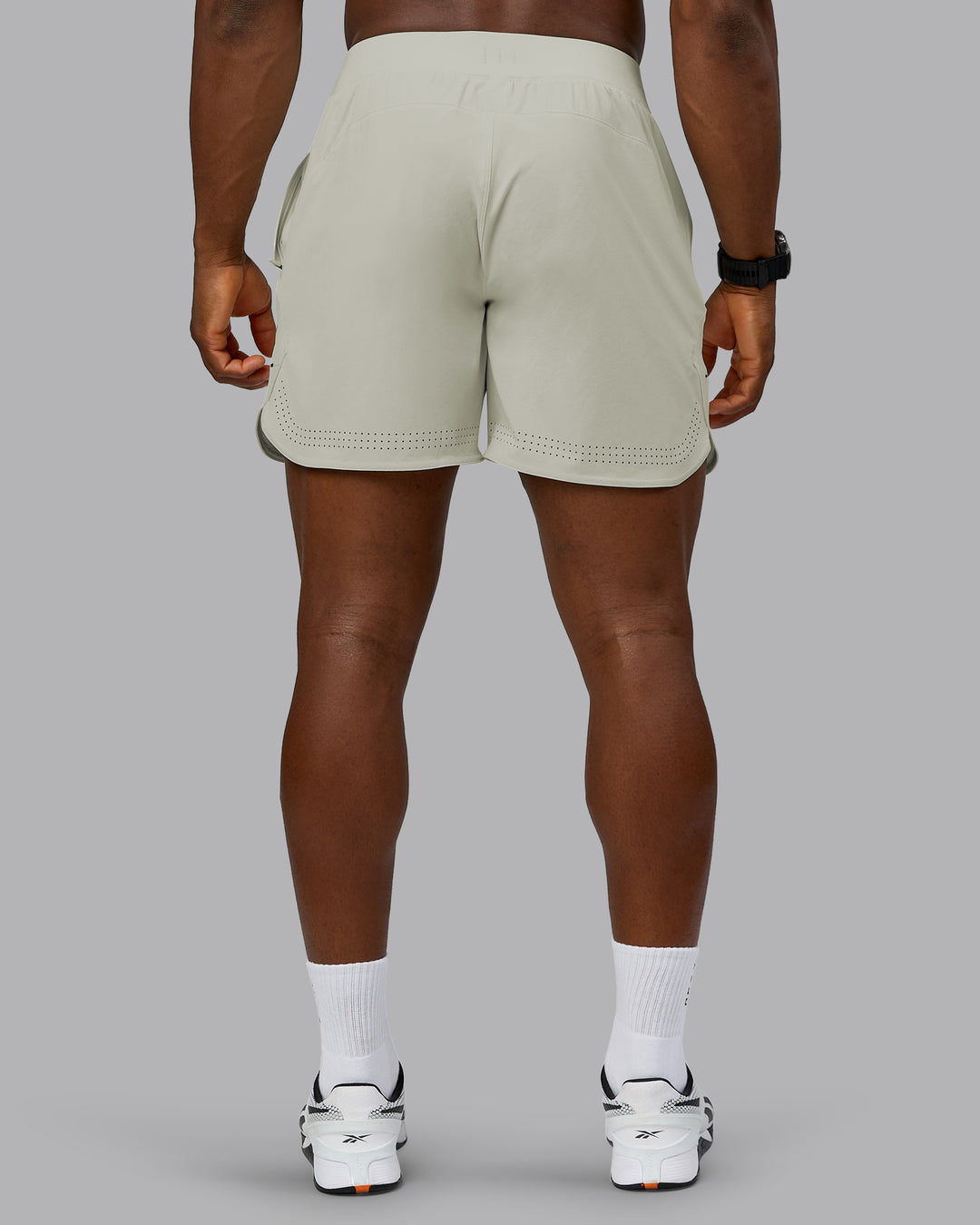 Man wearing Lift 6&quot; Performance Short - Bone | Model:Sam | Size:L
