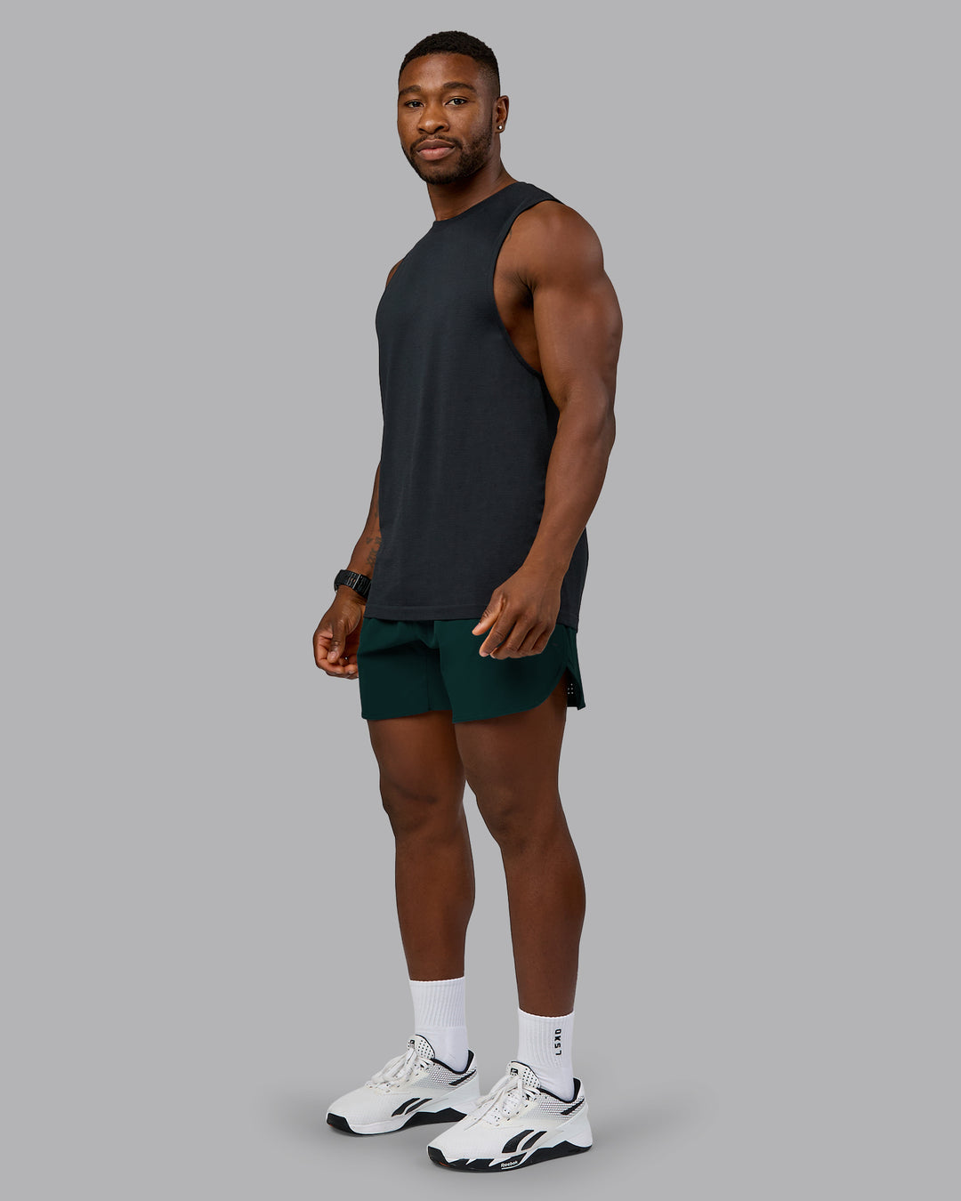 Man wearing Lift 6&quot; Performance Short - Dark Moss | Model:Sam | Size:L