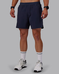 Man wearing Lift 6" Performance Shorts - Future Navy
