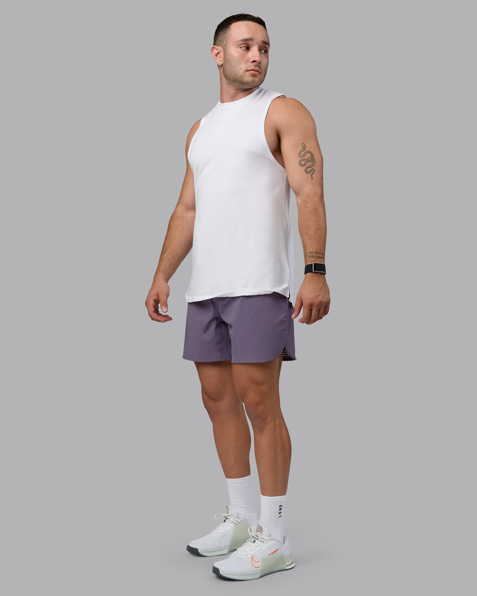 Man wearing Lift 6" Performance Shorts - Purple Sage