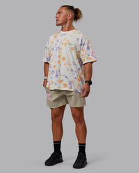 Man wearing Lift 6" Performance Shorts - Sand-So Cal 24