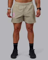 Man wearing Lift 6" Performance Shorts - Sand-So Cal 24