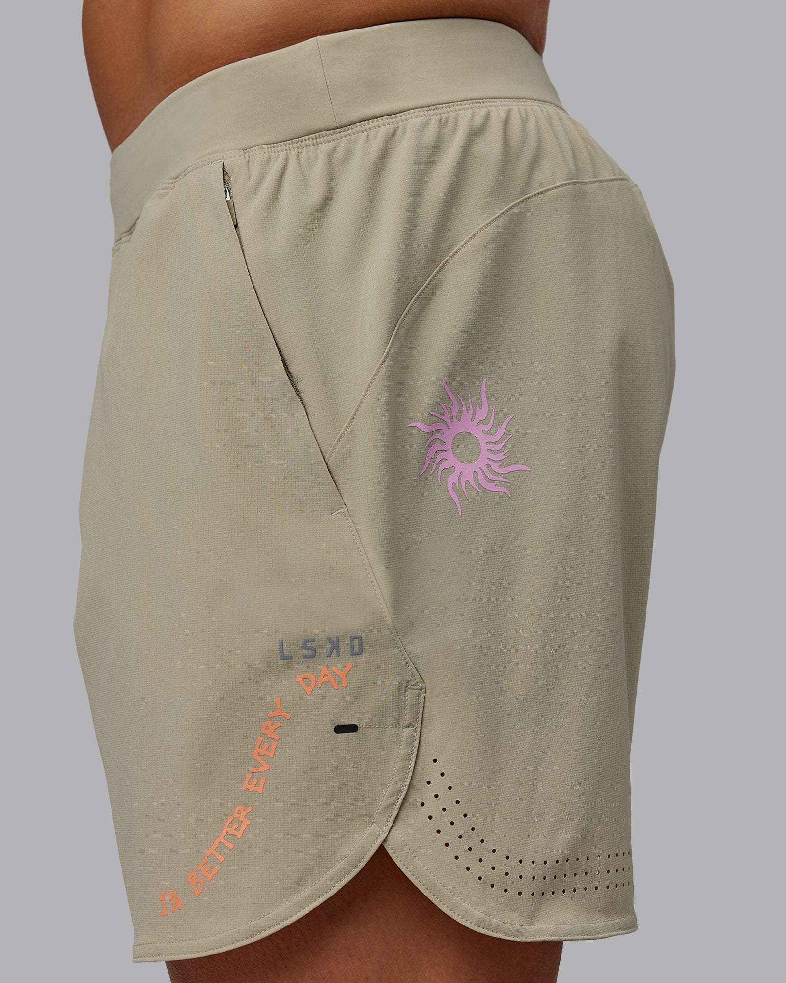 Man wearing Lift 6" Performance Shorts - Sand-So Cal 24
