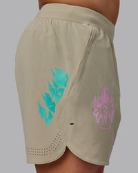 Man wearing Lift 6" Performance Shorts - Sand-So Cal 24