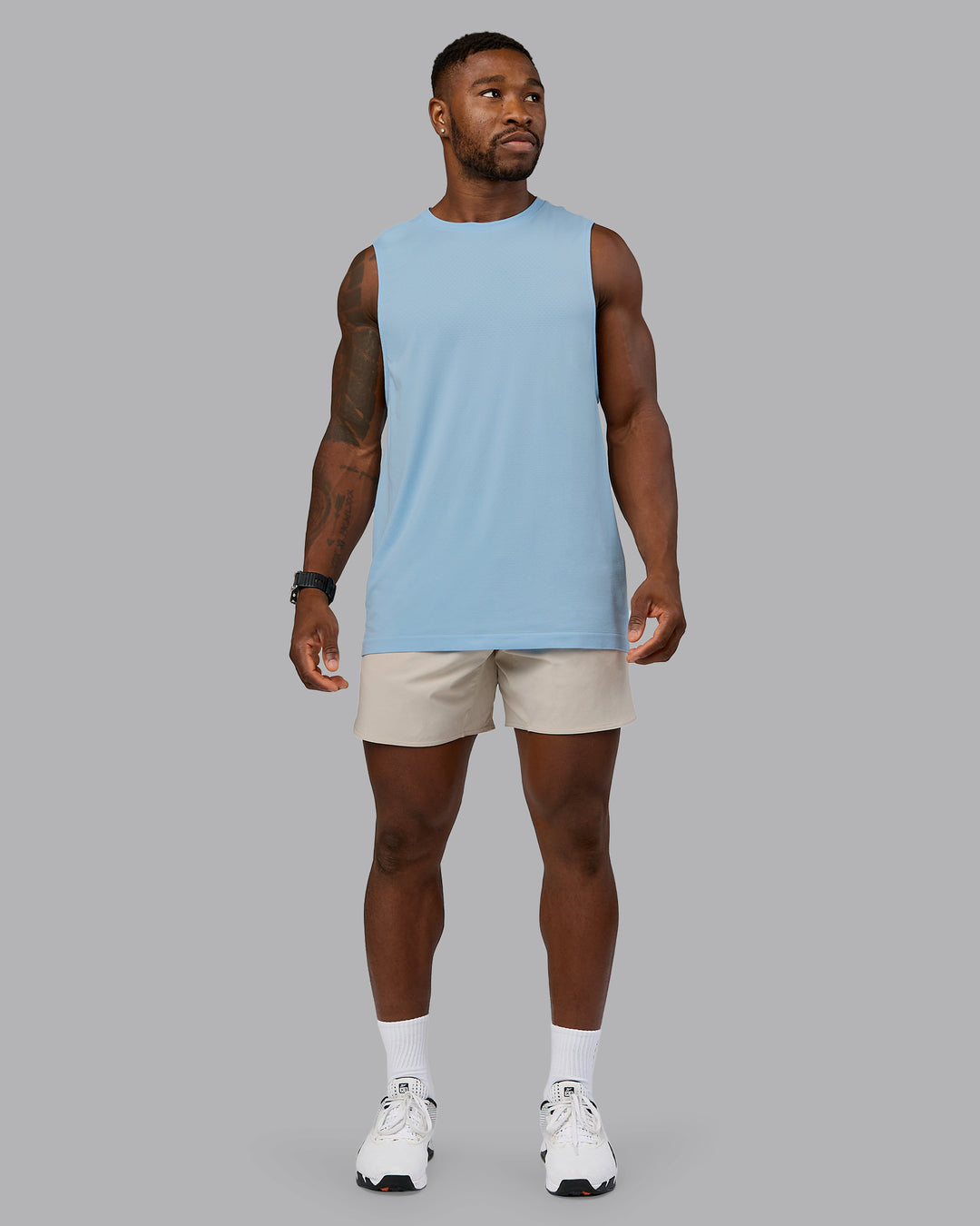 Man wearing Lift 6&quot; Performance Short - Shale-Beige | Model:Sam | Size:L
