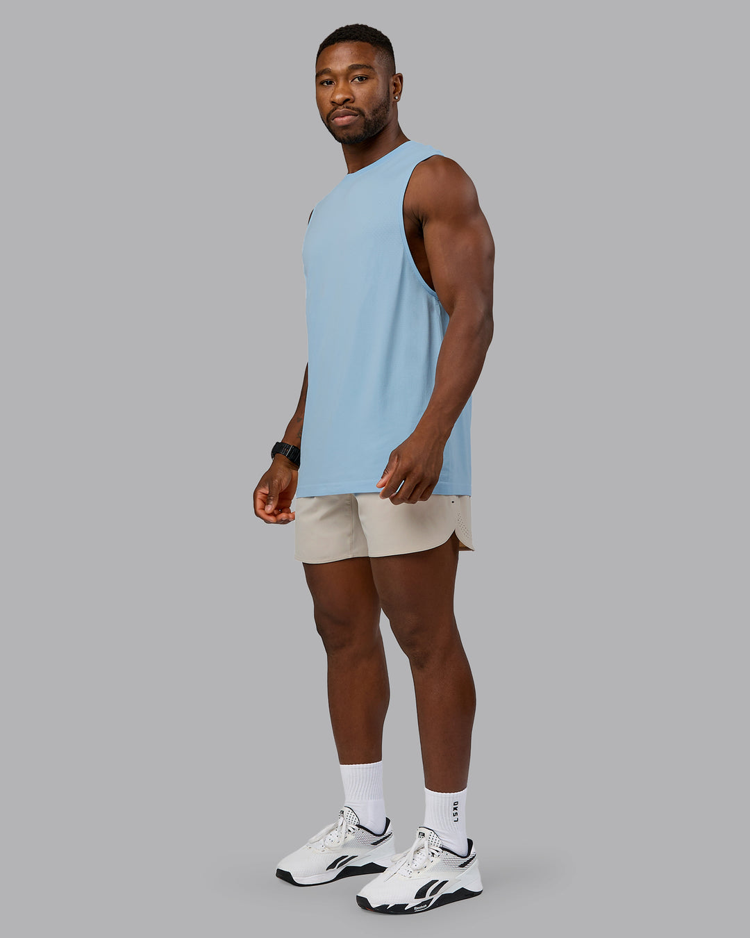 Man wearing Lift 6&quot; Performance Short - Shale-Beige | Model:Sam | Size:L