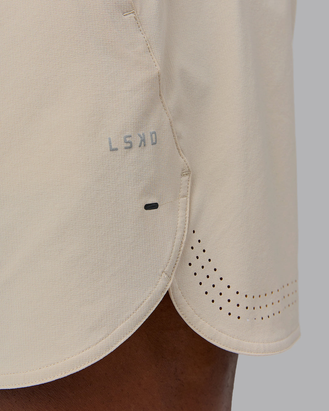 Man wearing Lift 6&quot; Performance Short - Shale-Beige | Model:Sam | Size:L