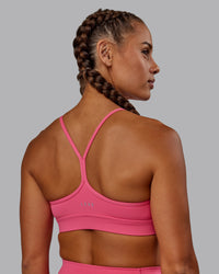 Woman wearing Lift High Neck Sports Bra - Hot Pink