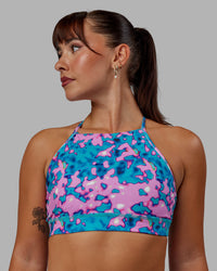 Woman wearing Lift High Neck Sports Bra - Neon Camo