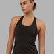 Woman wearing Lift Racerback Active Tank - Dark Walnut