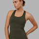 Woman wearing Lift Performance Tank - Forest Night