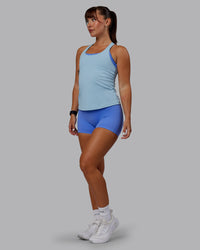 Woman wearing Lift Performance Tank - Glacial Blue