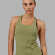 Woman wearing Lift Performance Tank - Moss Stone