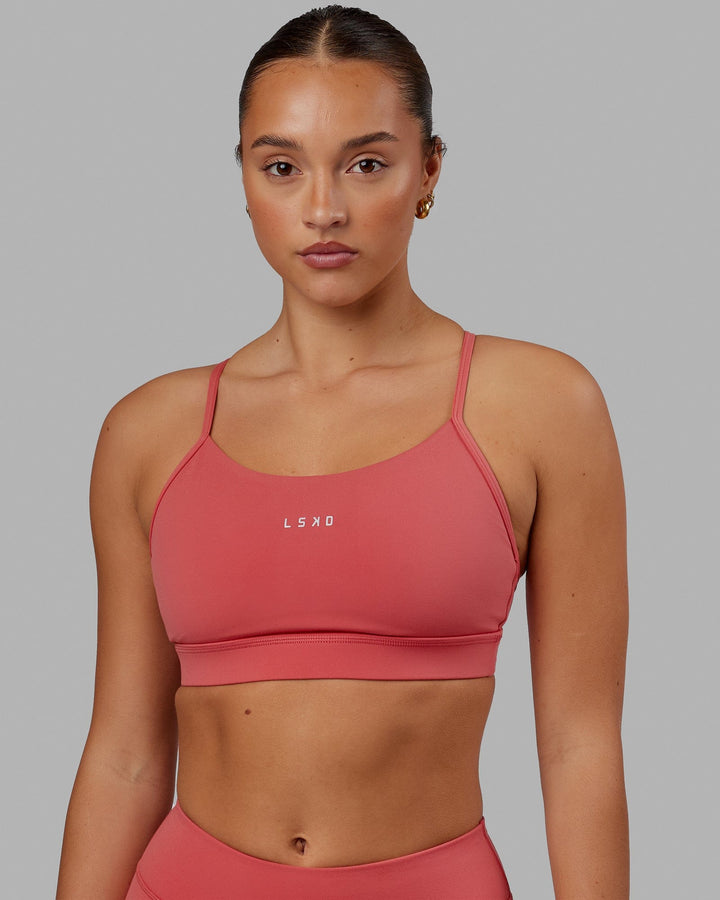 Woman wearing Lift Sports Bra - Mineral Red