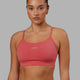 Woman wearing Lift Sports Bra - Mineral Red