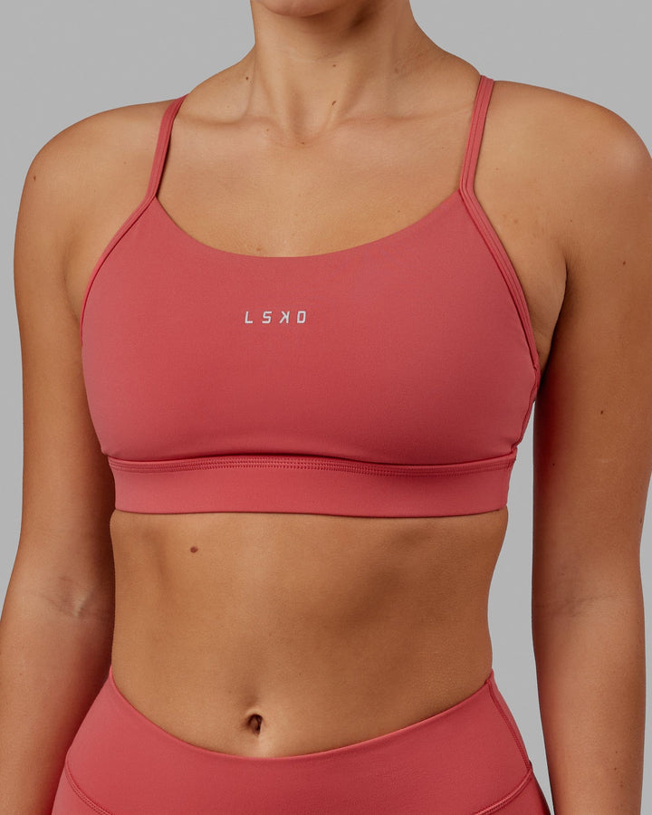 Woman wearing Lift Sports Bra - Mineral Red