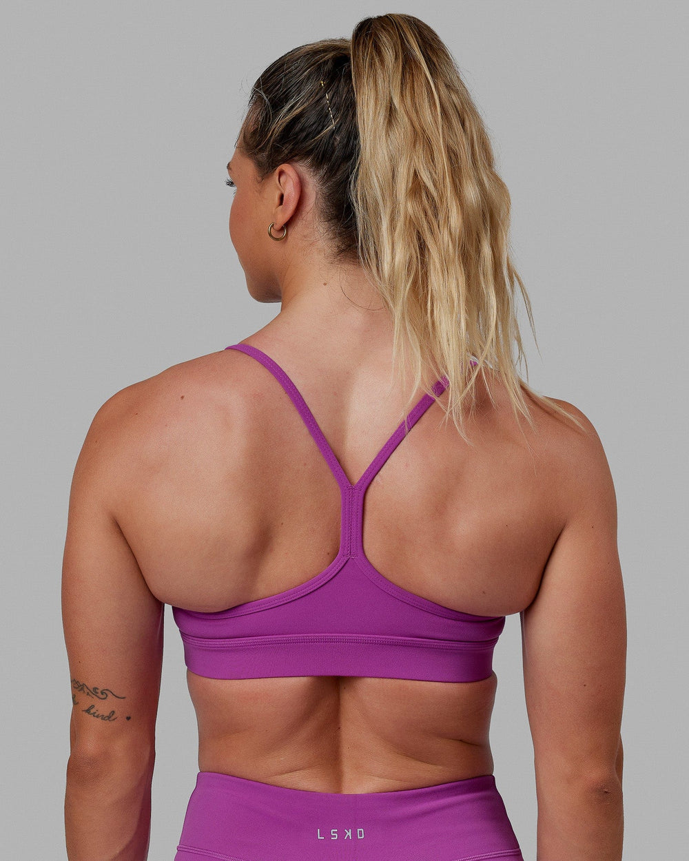 Woman wearing Lift Sports Bra - Orchid
