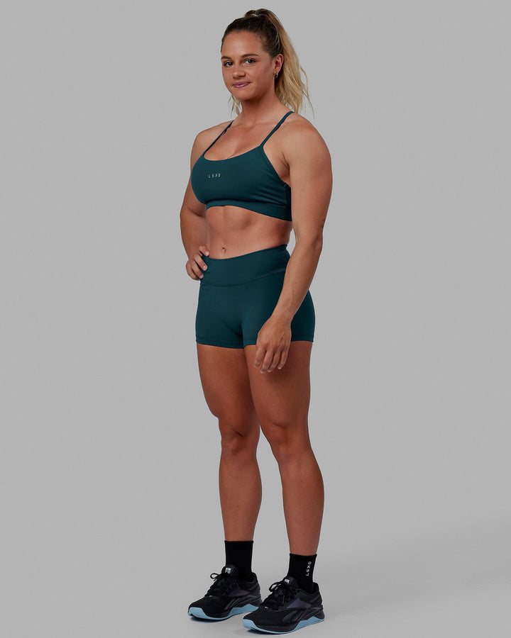 Woman wearing Lift Sports Bra - Tidal Teal