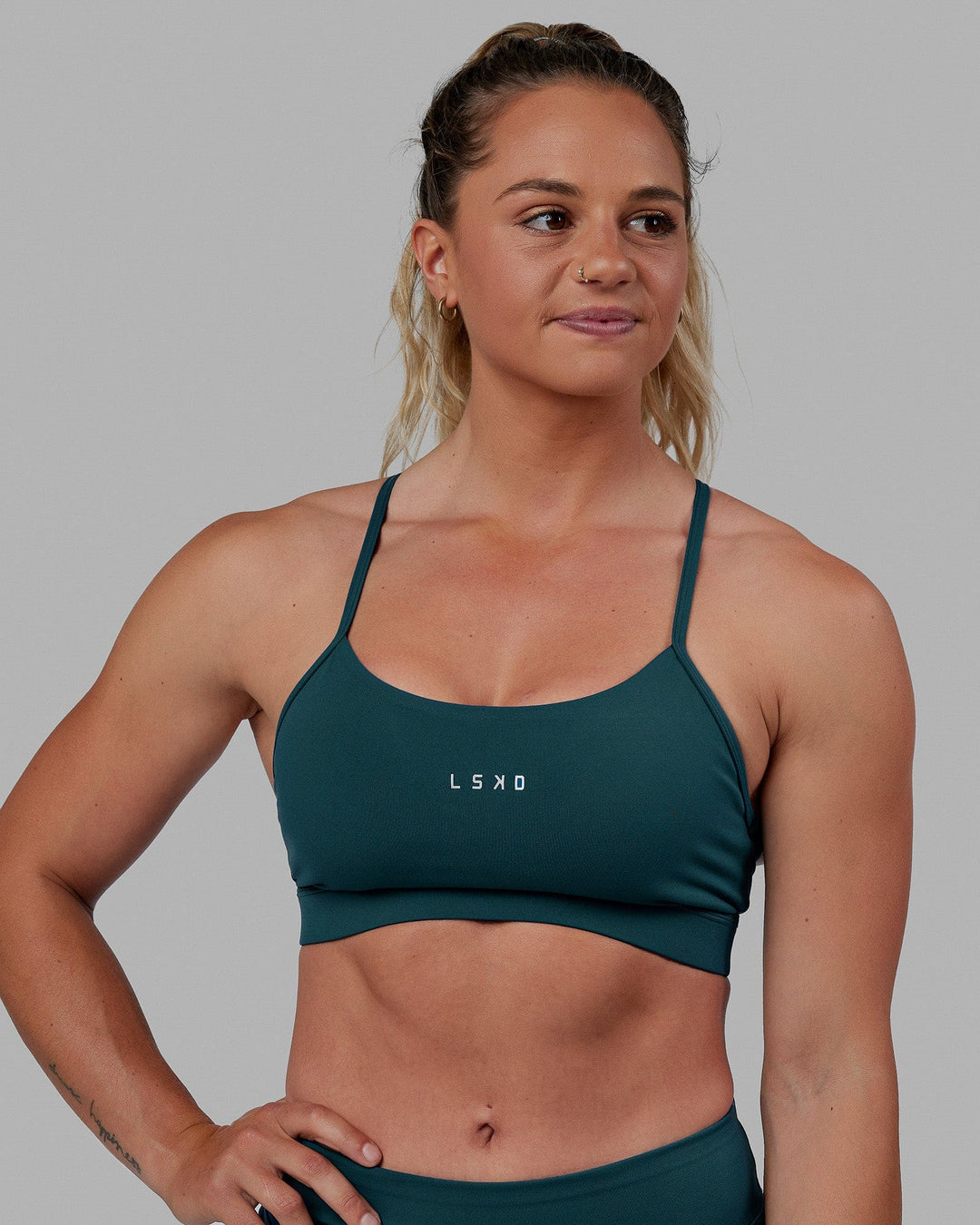 Woman wearing Lift Sports Bra - Tidal Teal