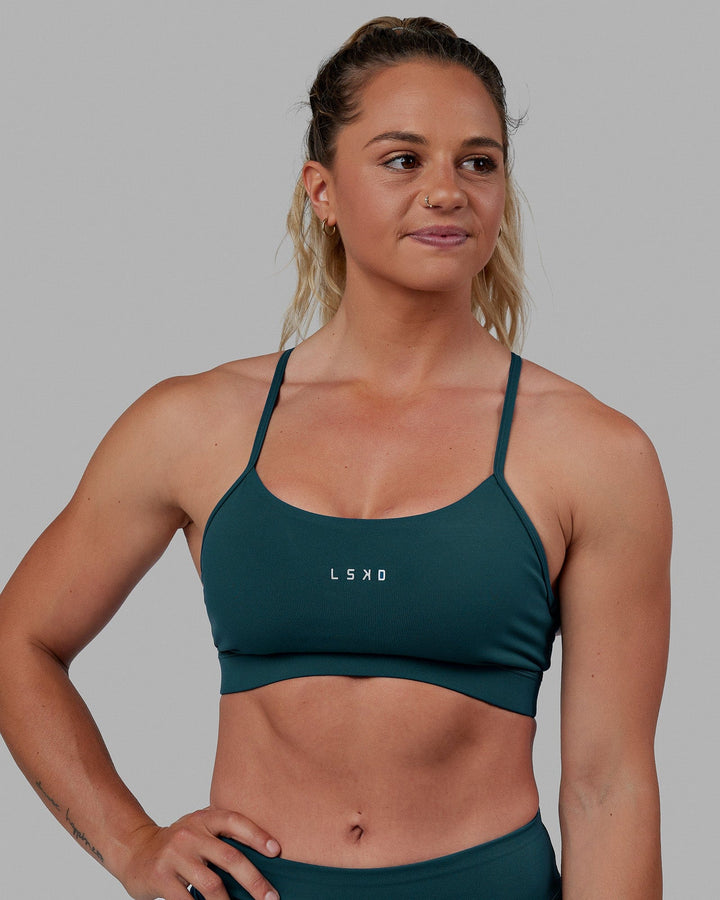 Woman wearing Lift Sports Bra - Tidal Teal