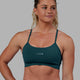 Woman wearing Lift Sports Bra - Tidal Teal